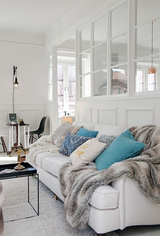 Farmhouse-inspired glass wall partition blending rustic charm with modern open-space functionality.