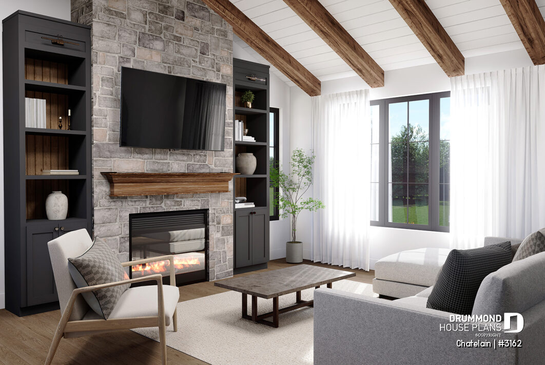 Living room in a bright single-story house with stone fireplace, cathedral ceiling and large windows – Chatelain (#3162)