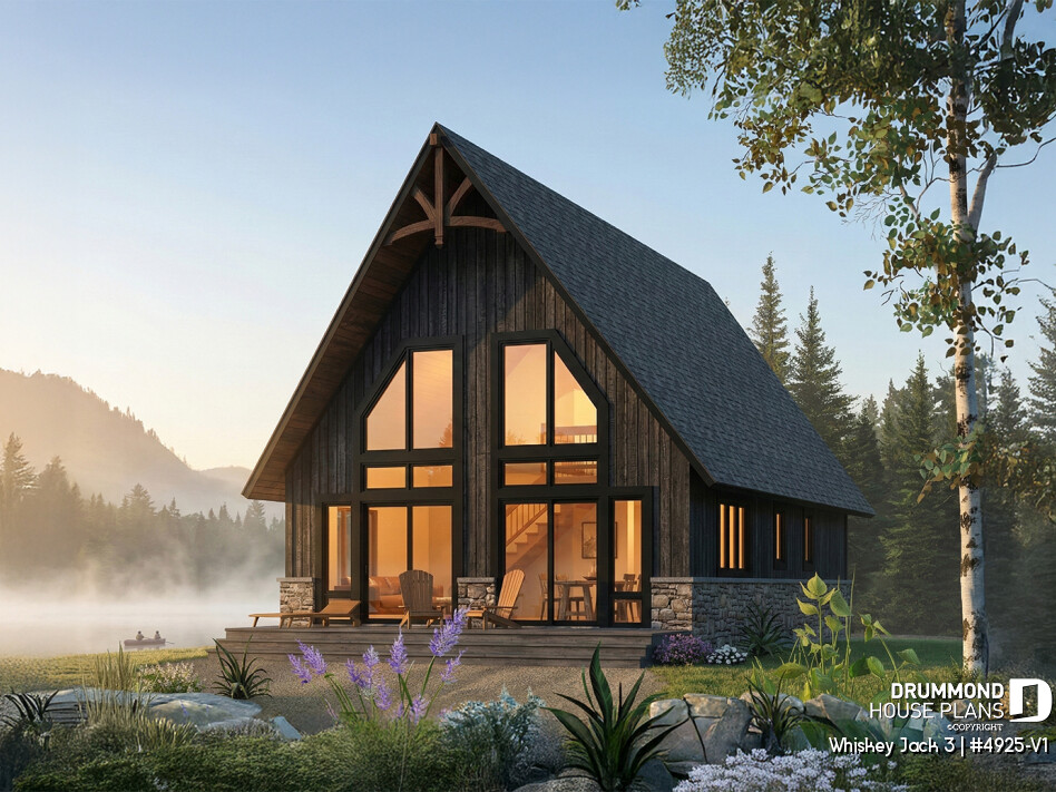 Small lakefront cabin plan Whiskey Jack 3 4925-V1 with loft 3 bedrooms large windows glowing at sunset in a natural setting