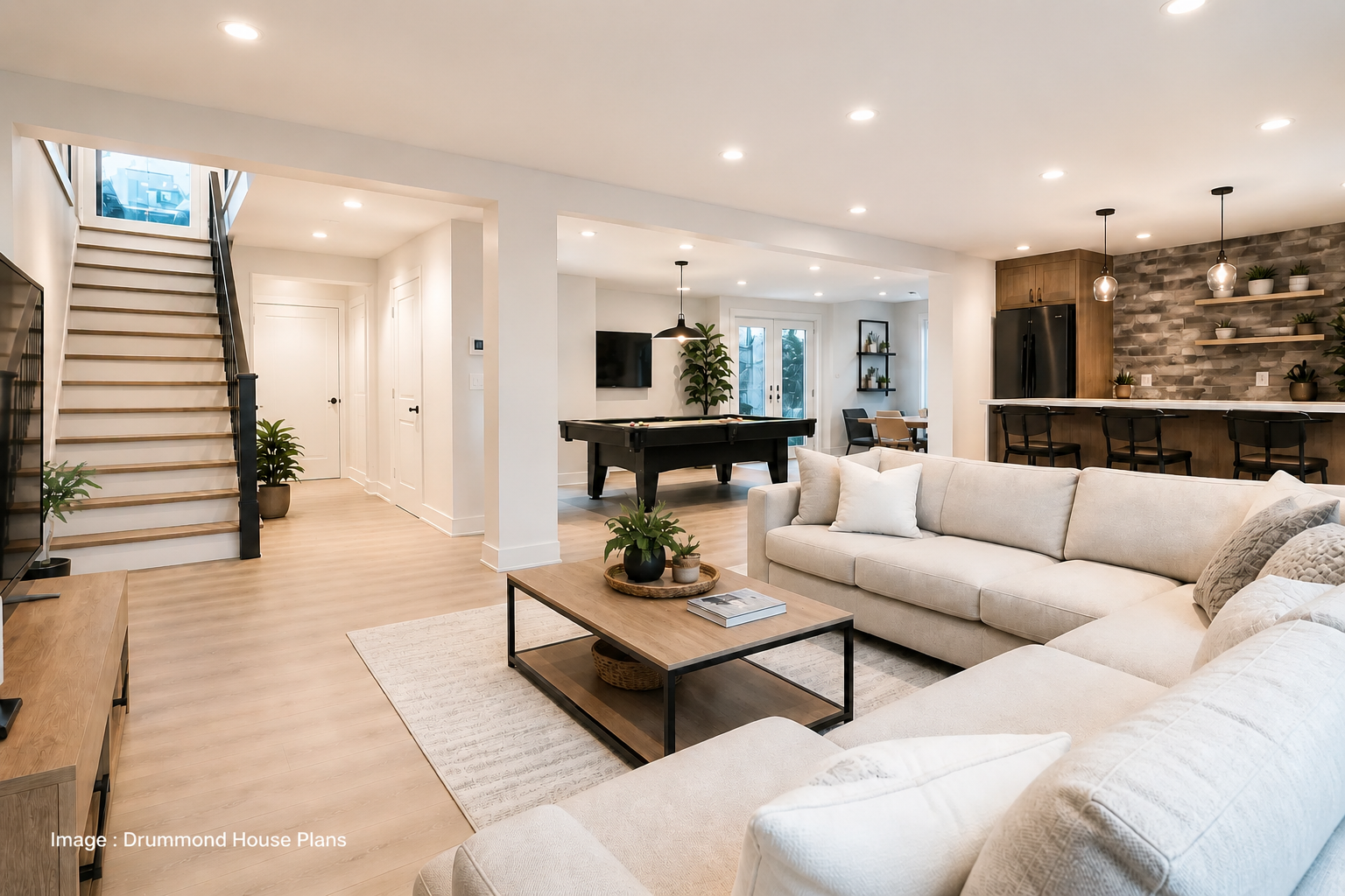 Modern finished basement with cozy family room, pool table, open entertainment space and contemporary bar area