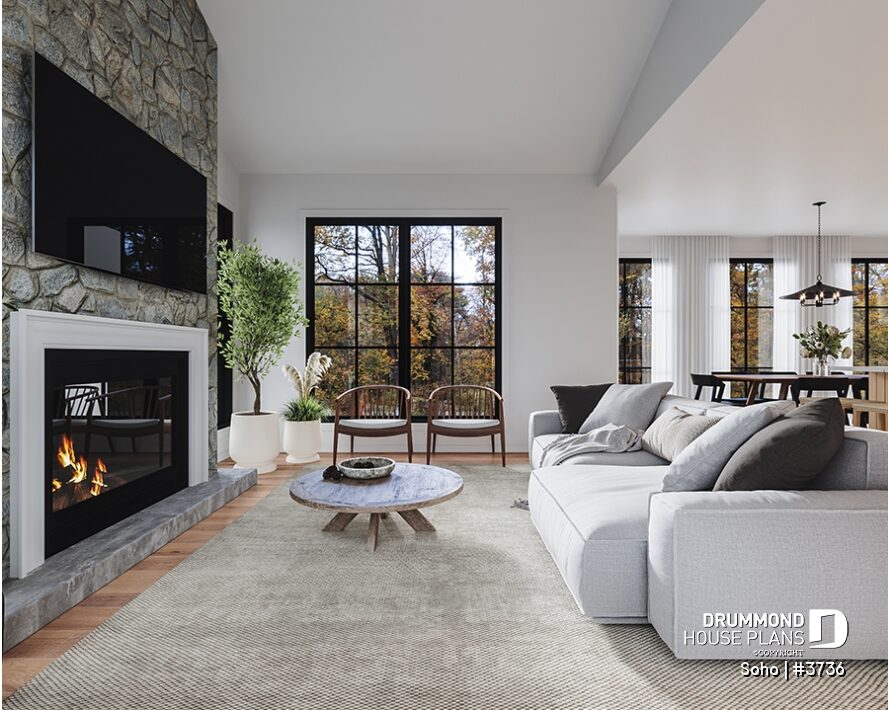 Great room with floor-to-ceiling stone fireplace, large windows and cathedral ceiling in the Soho (#3736) house plan