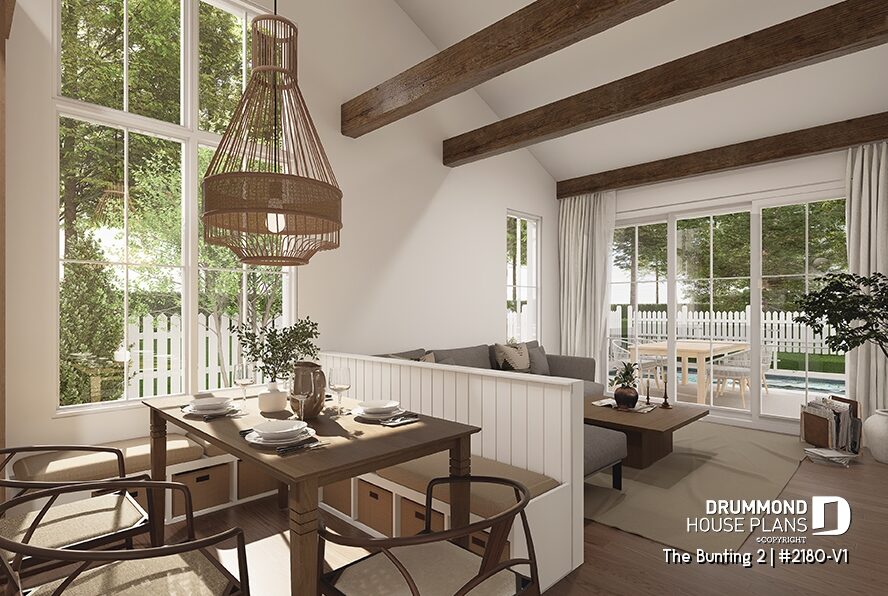 Open-concept interior of The Bunting 2 (#2180-V1) featuring cathedral ceiling, large windows and farmhouse-inspired living space