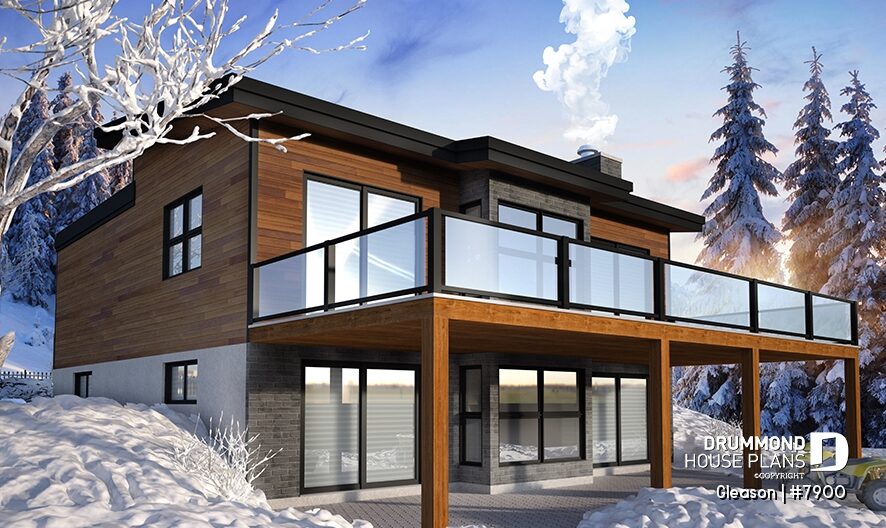Rear view of Gleason #7900, a modern shed roof cottage with walkout basement, large elevated terrace, glass railings, and wood siding.